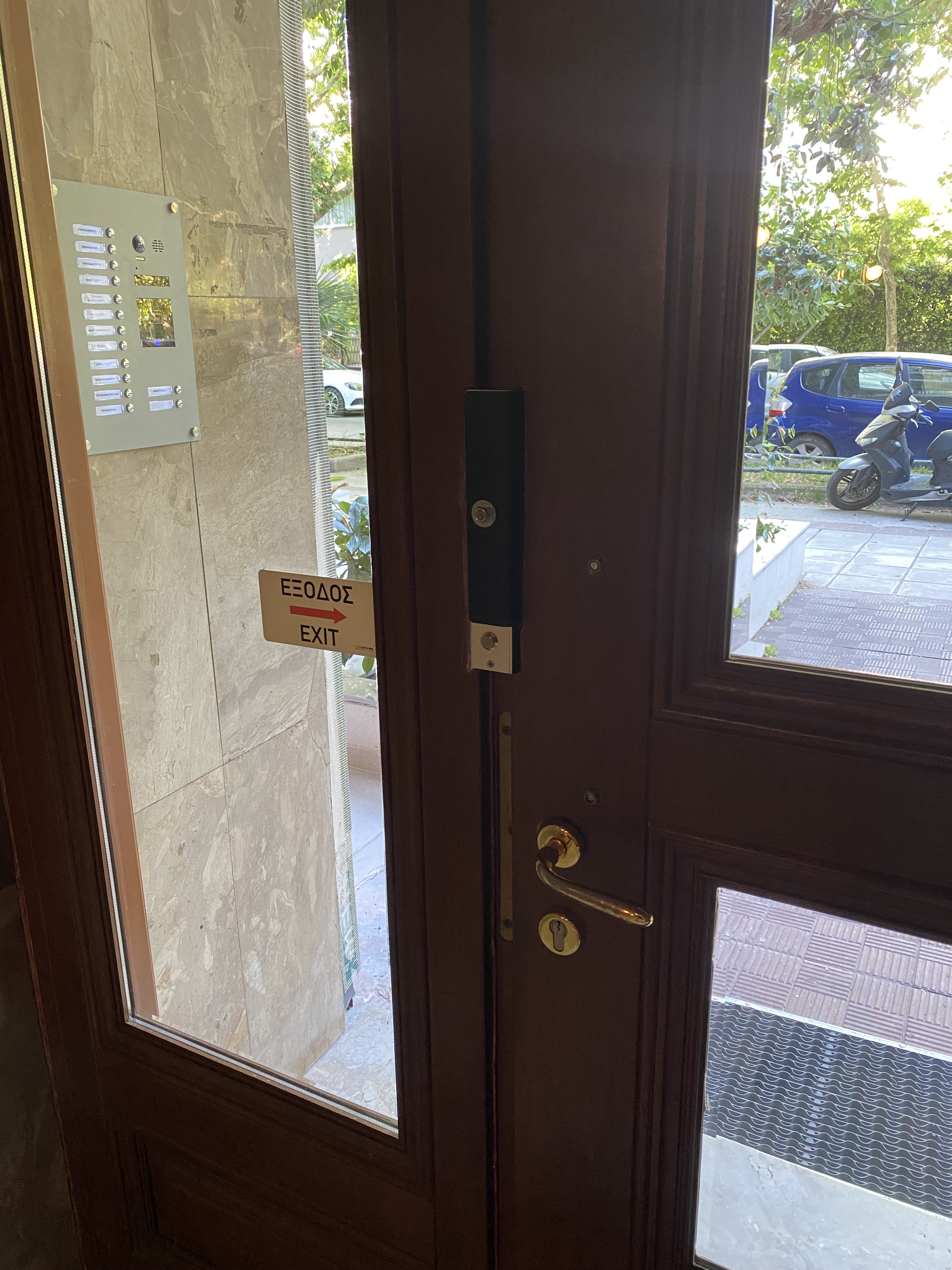 Electromagnetic lock installation at the main entrance of a block of flats   